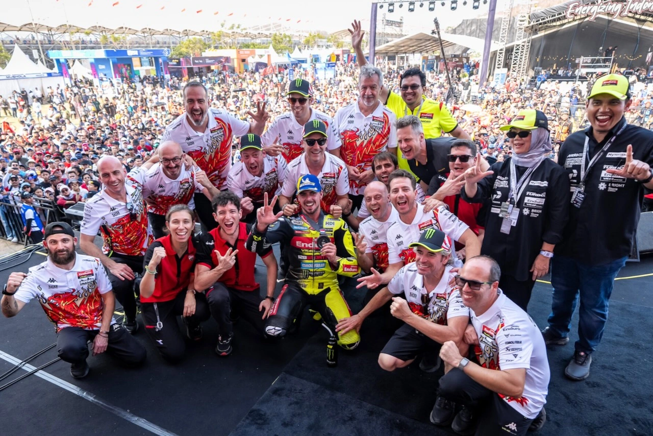 Di Giannantonio Sprint podium celebration with VR46 team members and fans at Mandalika