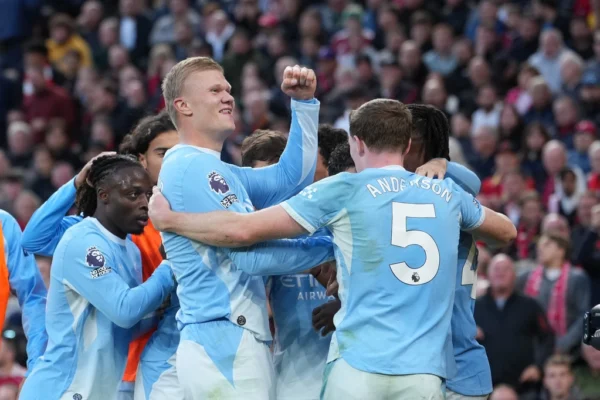Erling Haaland celebrates with Man City teammates after scoring the opening goal in Liverpool vs Man City